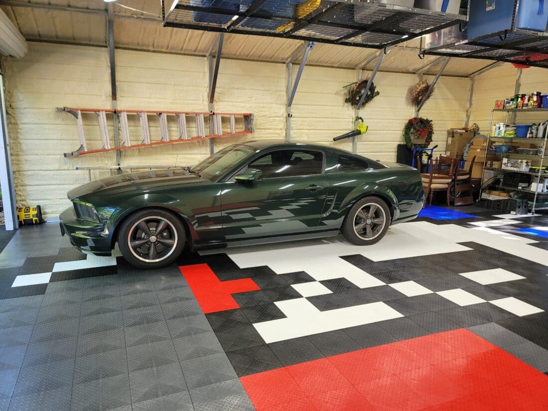Black Car on top of diamond tiles