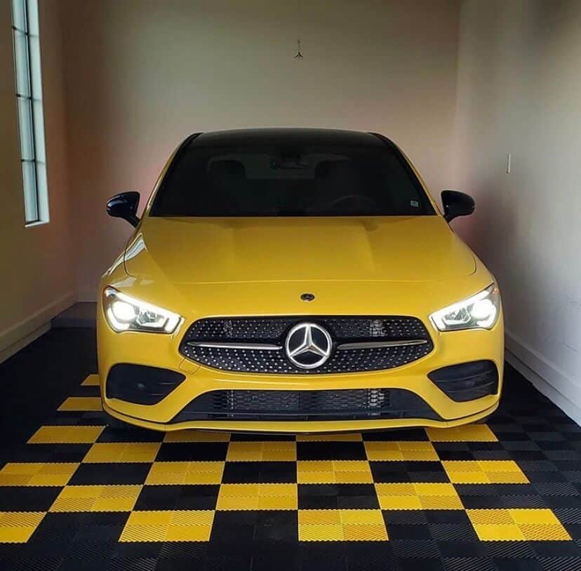 Yellow Mercedes Benz on Black and Yellow Garage Floor Tiles