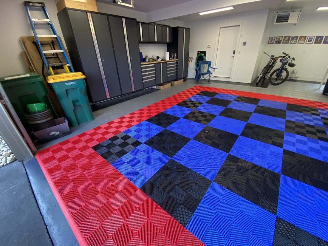Red, blue, black, and silver garage floor tiles