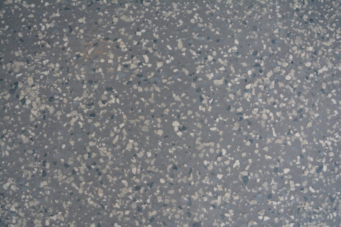 Close up of garage floor coating and flake