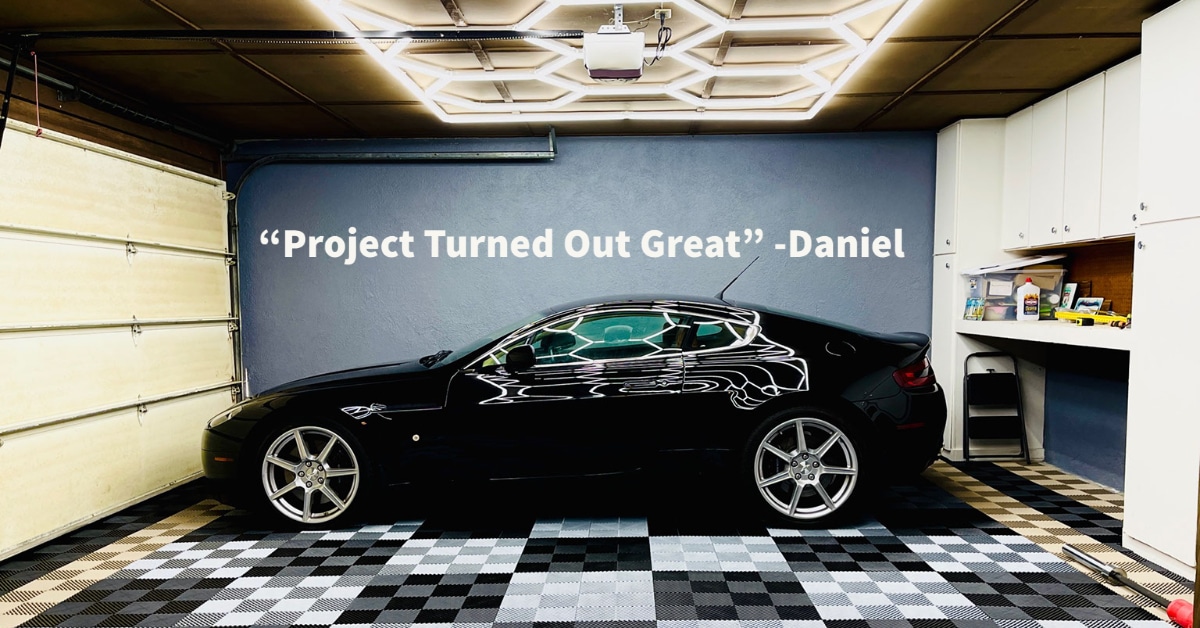Checkerboard RaceDeckÂ® Free-FlowÂ® tiles with black car and quote that says "project turned out great"