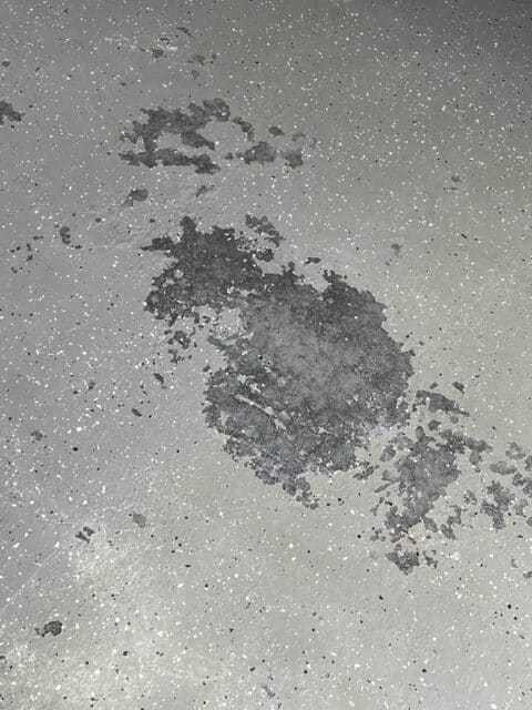 A closeup of damaged epoxy floor