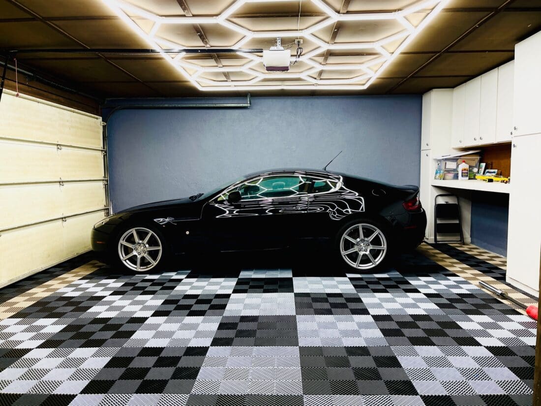 Beauty Shot of Black Car on RaceDeckÂ® Free-FlowÂ® tiles