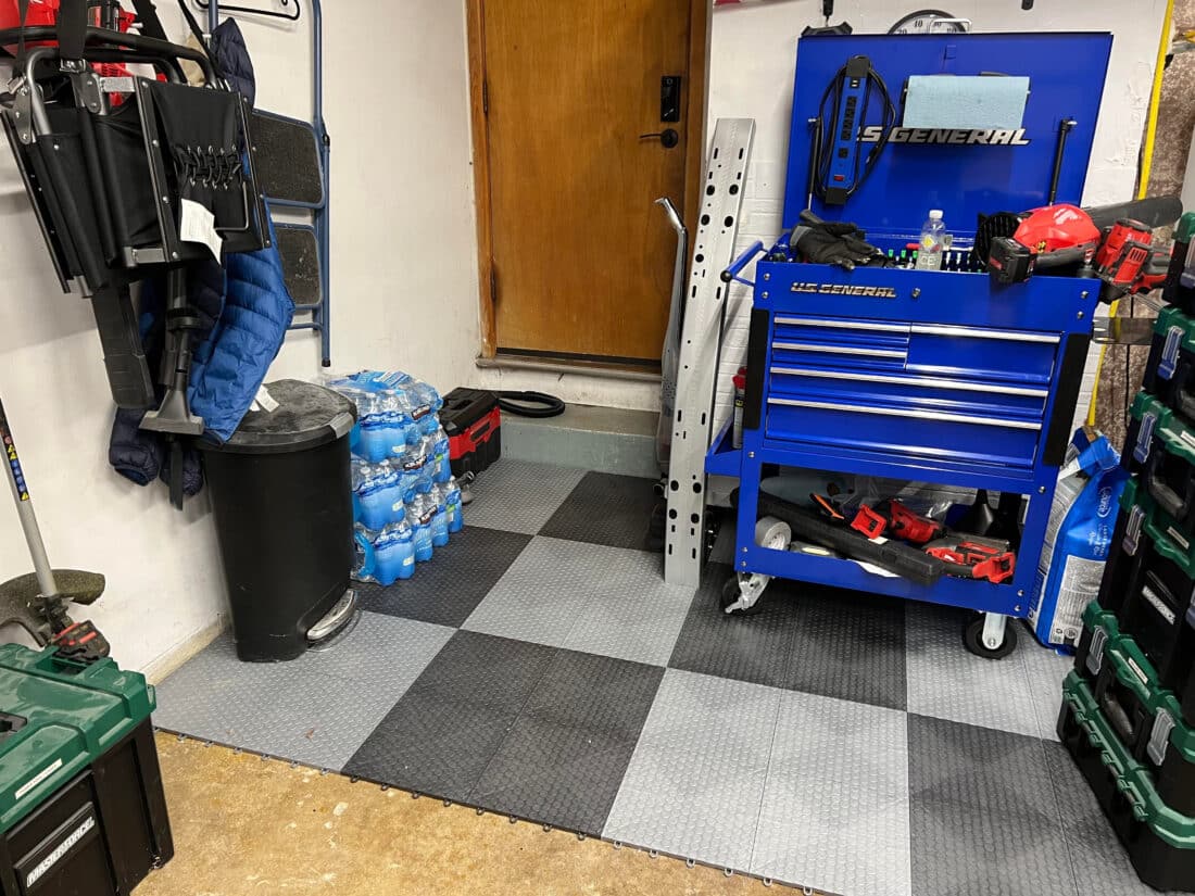 Toolbox on Checkerboard floor made with graphite and silver tiles