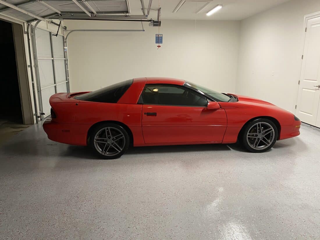 Light Grey Polyurea Floor with Red Vehicle