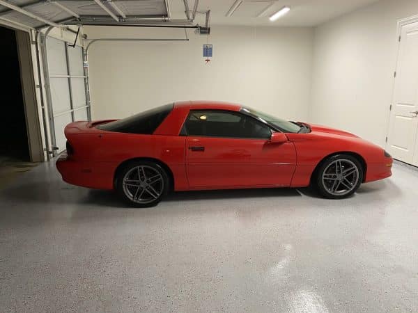 Light Grey Polyurea Floor with Red Vehicle
