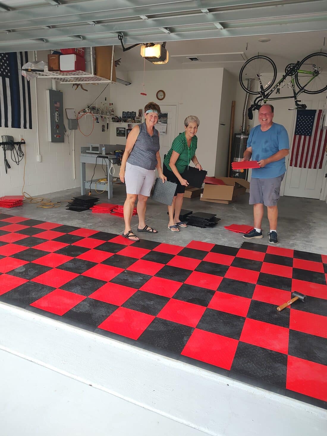A group of friends installing TrueLock HDXT Diamond Tiles