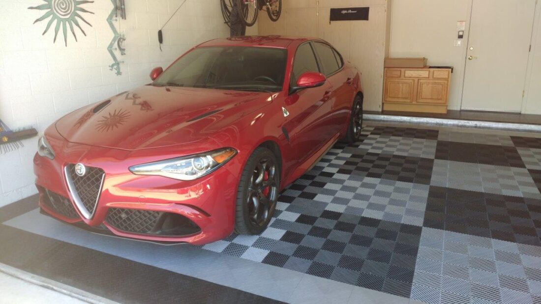 red car on checkerboard tiles