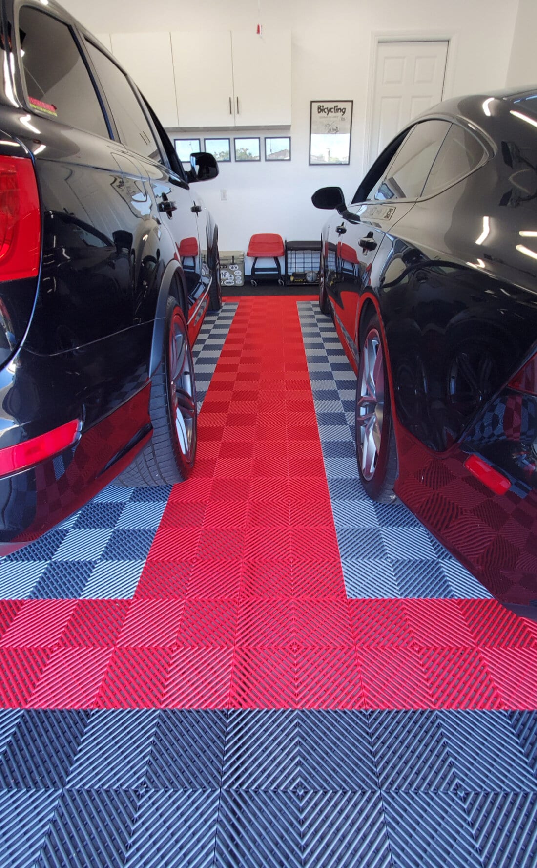 Ribbed garage floor tiles with black cars